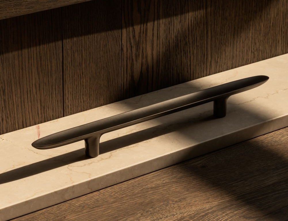 LEAF pull bar 400 mm in Gunmetal black by BRANDT Copenhagen and Norm architects. Kitchen handle in solid brass - ideal as appliance pull.
