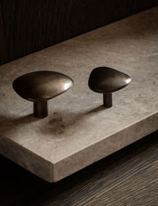 NOBLE knob og hook in Burnished Brass Patina made of solid brass and organically shaped. Designed by Julie Brandt for BRANDT Copenhagen. 