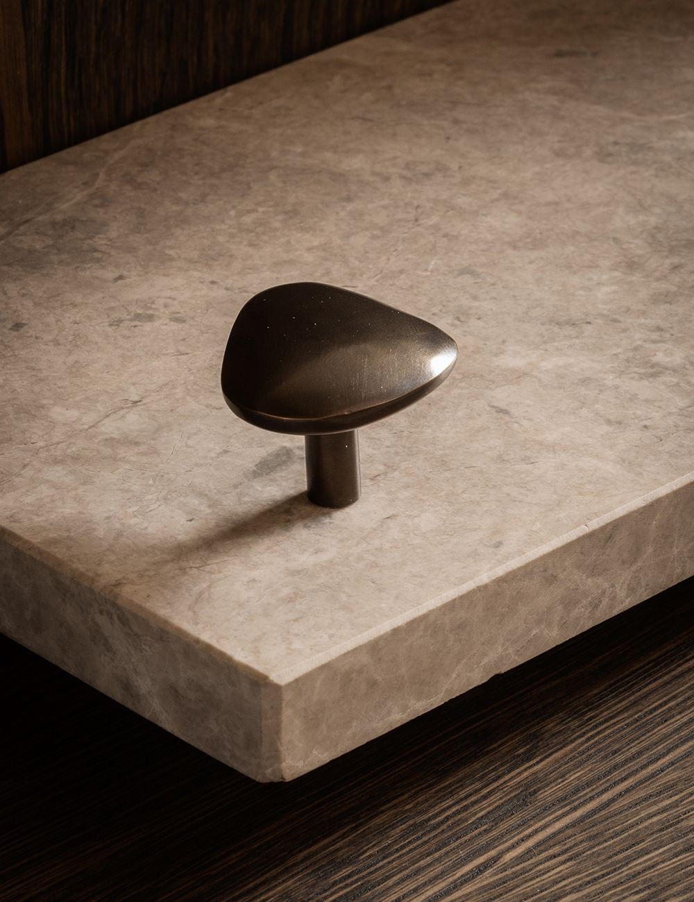 NOBLE knob in Burnished Brass Patina made of solid brass and organically shaped. Designed by Julie Brandt for BRANDT. Copenhagen. 