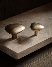 NOBLE knob in satin brass made of solid brass. Our organically shaped hardware collection is designed by Julie Brandt for BRANDT Copenhagen.