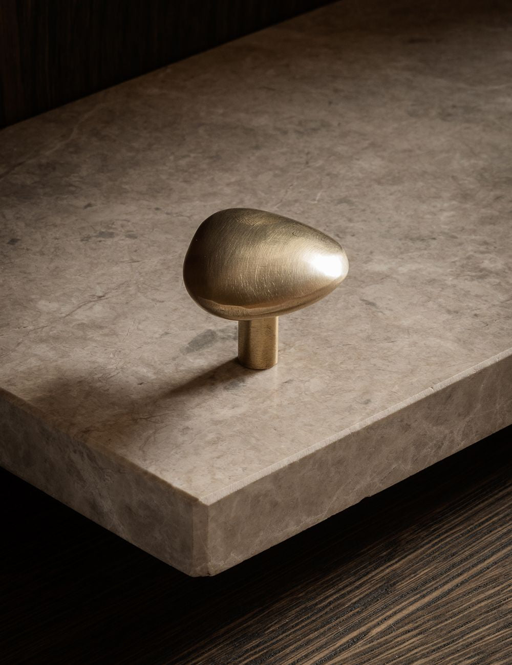 NOBLE knob in satin brass made of solid brass. Our organically shaped hardware collection is designed by Julie Brandt for BRANDT Copenhagen.
