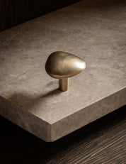 NOBLE knob in satin brass made of solid brass. Our organically shaped hardware collection is designed by Julie Brandt for BRANDT Copenhagen.