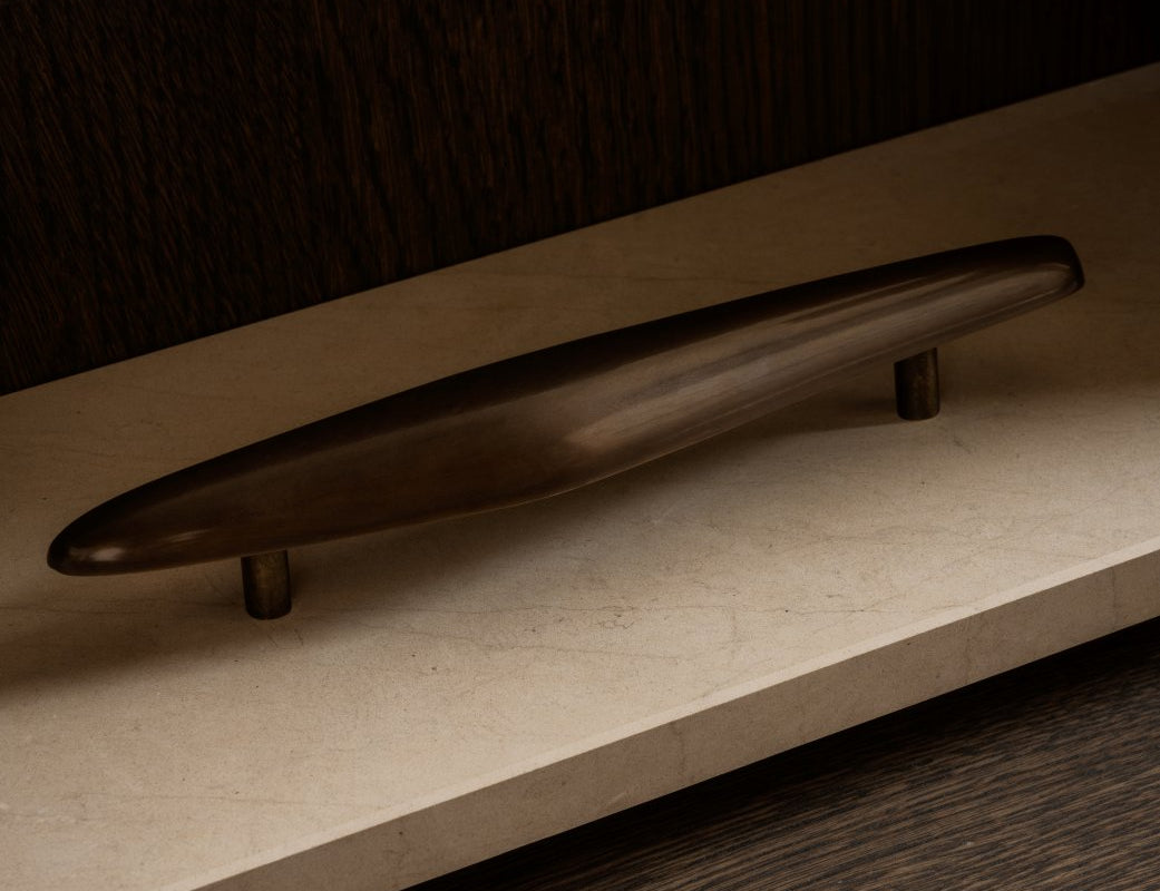 NOBLE pull bar long in Burnished Brass patina. Part of our organic hardware collection designet by Julie Brandt for BRANDT Copenhagen. The collection constist of cabinet knobs, T-bars, pull bars and hooks