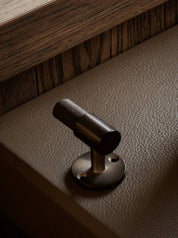 SIGNATURE hook for tea towels or bathroom towels made of solid brass with finish in Burnished Brass and wenge. Designed by Julie Brandt for BRANDT Copenhagen. 