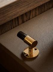 SIGNATURE hook for tea towels or bathroom towels made of solid brass with finish in Polished Brass and Black Horn. Designed by Julie Brandt for BRANDT Copenhagen.