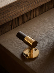 SIGNATURE hook for tea towels or bathroom towels made of solid brass with finish in Polished Brass and Wenge. Designed by Julie Brandt for BRANDT Copenhagen.