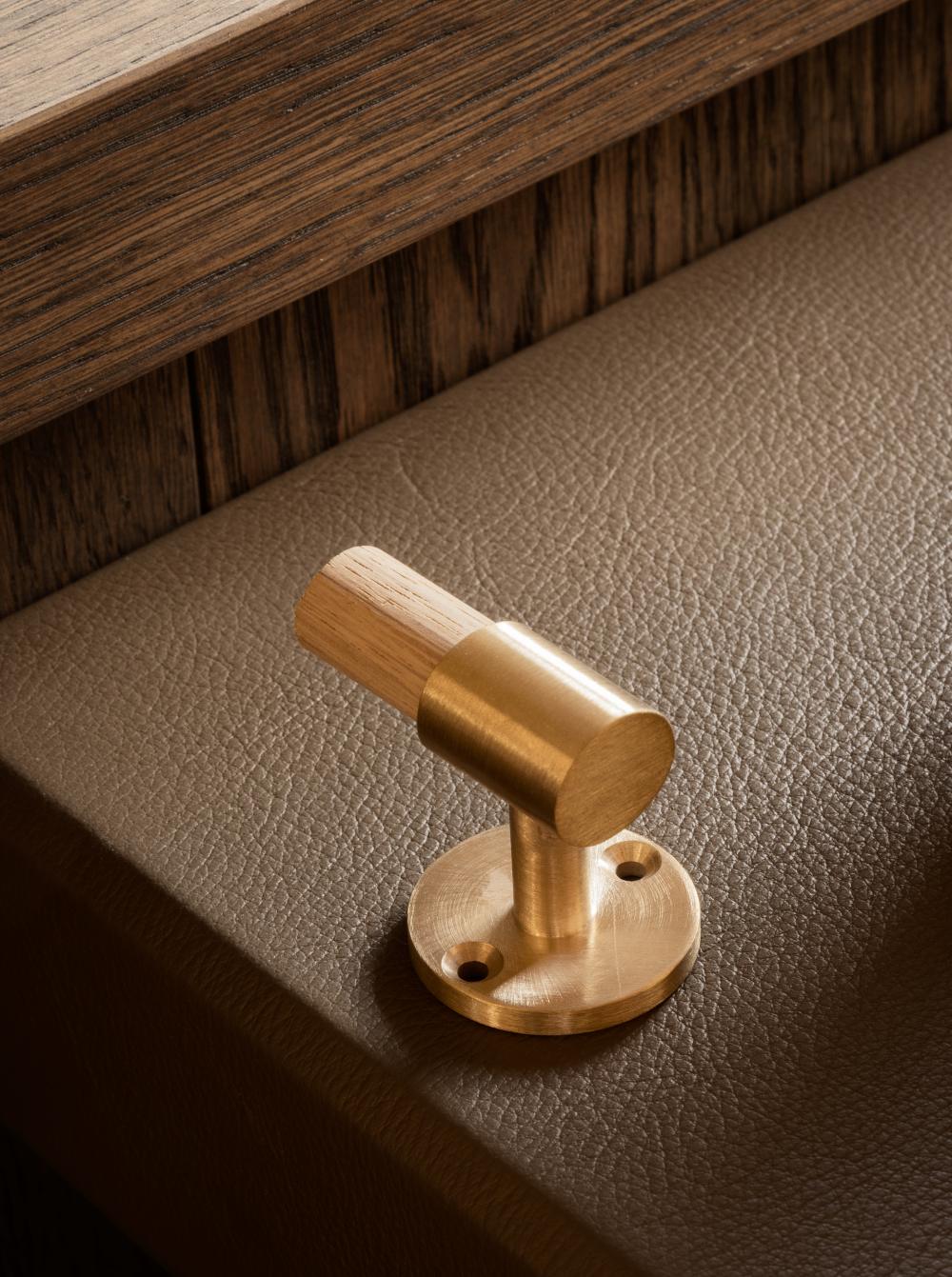 SIGNATURE hook for tea towels or bathroom towels made of solid brass with finish in Satin Brass. Designed by Julie Brandt for BRANDT Copenhagen.