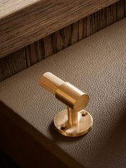 SIGNATURE hook for tea towels or bathroom towels made of solid brass with finish in Satin Brass. Designed by Julie Brandt for BRANDT Copenhagen.