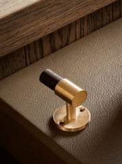 SIGNATURE hook for tea towels or bathroom towels made of solid brass with finish in Satin Brass. Designed by Julie Brandt for BRANDT Copenhagen.