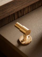 SIGNATURE hook for tea towels or bathroom towels made of solid brass with finish in Satin Brass. Designed by Julie Brandt for BRANDT Copenhagen.