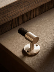 SIGNATURE hook for tea towels or bathroom towels made of solid brass with finish in Satin Nickel and Black Horn. Designed by Julie Brandt for BRANDT Copenhagen.