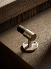 SIGNATURE hook for tea towels or bathroom towels made of solid brass with finish in Satin Nickel and Wenge. Designed by Julie Brandt for BRANDT Copenhagen.