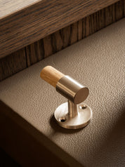 SIGNATURE hook for tea towels or bathroom towels made of solid brass with finish in Satin Nickel and Oak. Designed by Julie Brandt for BRANDT Copenhagen.