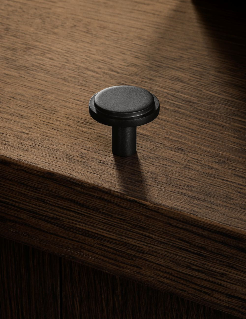 SIGNATURE knob - Nearly Black by BRANDT Copenhagen made of solid brass