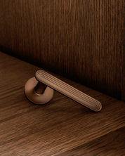 TERRACE door handle set in Burnished Brass from BRANDT Copenhagen. Designed in colab with Norm Architects.