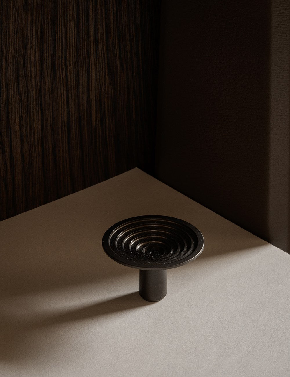 TERRACE knob in gunmetal black by BRANDT Copenhagen. A hardware collection in collab with Norm architects consisting of knobs, T-bars and pull bars.