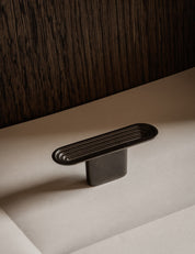 TERRACE T-bar in Gunmetal by BRANDT Copenhagen. A hardware collection in collab with Norm architects consisting of knobs, T-bars and pull bars.