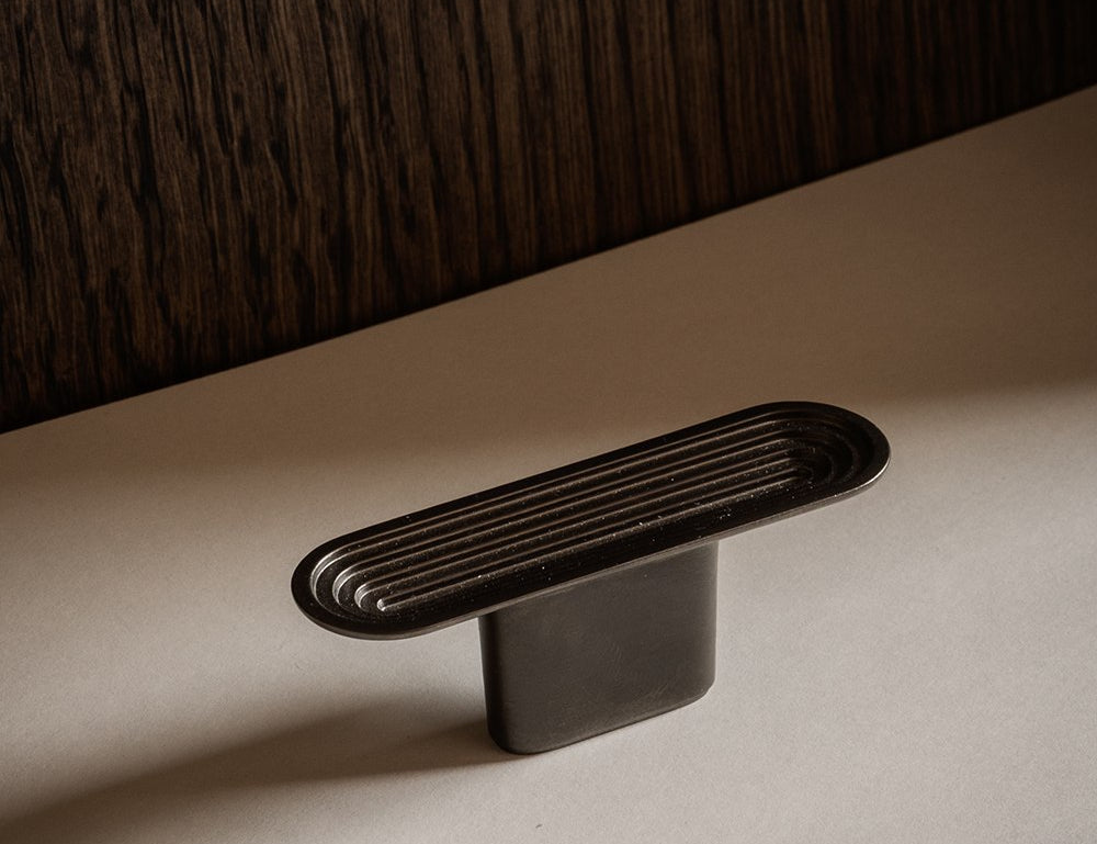 TERRACE T-bar in Gunmetal by BRANDT Copenhagen. A hardware collection in collab with Norm architects consisting of knobs, T-bars and pull bars.