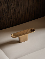 TERRACE T-bar in satin brass by BRANDT Copenhagen. A hardware collection in collab with Norm architects consisting of knobs, T-bars and pull bars.