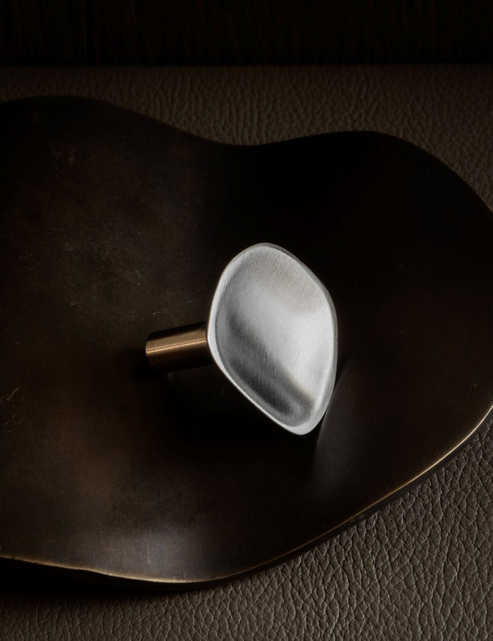 VALE knob in Satin Nickel. Vale collection is part og our organically shaped hardware for cabinets and kitchens. Designed by Julie Brandt for BRANDT Copenhagen.