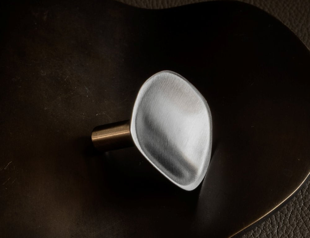 VALE knob in Satin Nickel. Vale collection is part og our organically shaped hardware for cabinets and kitchens. Designed by Julie Brandt for BRANDT Copenhagen.